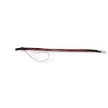 AN ANTIQUE NATIVE AMERICAN INDIAN WOODEN BOW Of curved form with carved finials and red painted