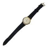 WATCHES OF SWITZERLAND, A VINTAGE YELLOW METAL GENT’S WRISTWATCH Having a circular white dial and