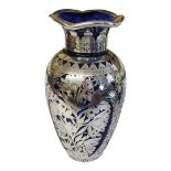 A LARGE 20TH CENTURY CONTINENTAL SILVER AND BLUE GLASS VASE Having a pierced floral overlaid