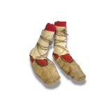 A PAIR OF ANTIQUE NATIVE AMERICAN INDIAN ANIMAL SKIN AND FABRIC MOCCASINS With hand stitched red,