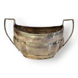 A GEORGIAN SILVER OVAL SUGAR BASIN With twin handles and engraved decoration, hallmarks rubbed. (