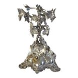 A VICTORIAN SILVER ORGANIC FORM CENTREPIECE On tripod base with shell decoration to feet, hallmarked
