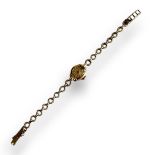 ACCURIST, A VINTAGE 9CT GOLD LADIES’ WRISTWATCH Cream tone dial marked, on a pierced 9ct bracelet