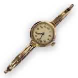 A VINTAGE 9CT GOLD LADIES’ COCKTAIL WATCH Having a cream tone dial with Arabic number markings, on