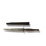 A VINTAGE COMMANDO FIGHTING KNIFE Having a textured brass handle,the blade marked J and I