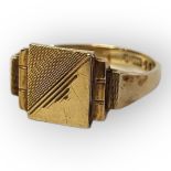 AN ART DECO 9CT GOLD GENT’S SIGNET RING Having a square stepped design with engraved decoration,