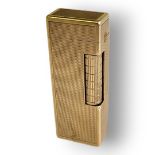 DUNHILL, A VINTAGE 9CT GOLD RECTANGULAR CIGARETTE LIGHTER With textured engine turned case,