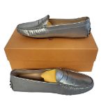 TOD’S, A PAIR OF LADIES’ SILVER LEATHER MOCASSINO SHOES Size 37½, with protective pouch, new in box.