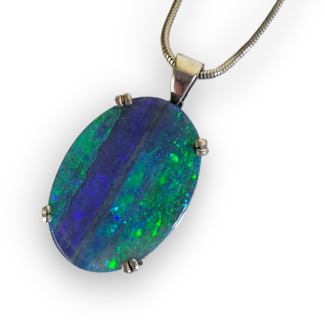 AN 18CT WHITE GOLD AND BOULDER OPAL PENDANT The oval flat cabochon boulder set in an 18ct gold mount - Image 2 of 2