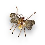 A LATE 19TH/EARLY 20TH CENTURY YELLOW METAL AND GEM SET ‘INSECT' BROOCH Set with ruby eyes and