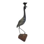 A VINTAGE SPANISH WHITE METAL MODEL OF A PEACOCK Standing pose with one leg raised and engraved