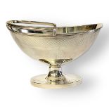 A GEORGIAN SILVER SWEETMEAT OVAL BASKET Classical form with single handle, engraved decoration