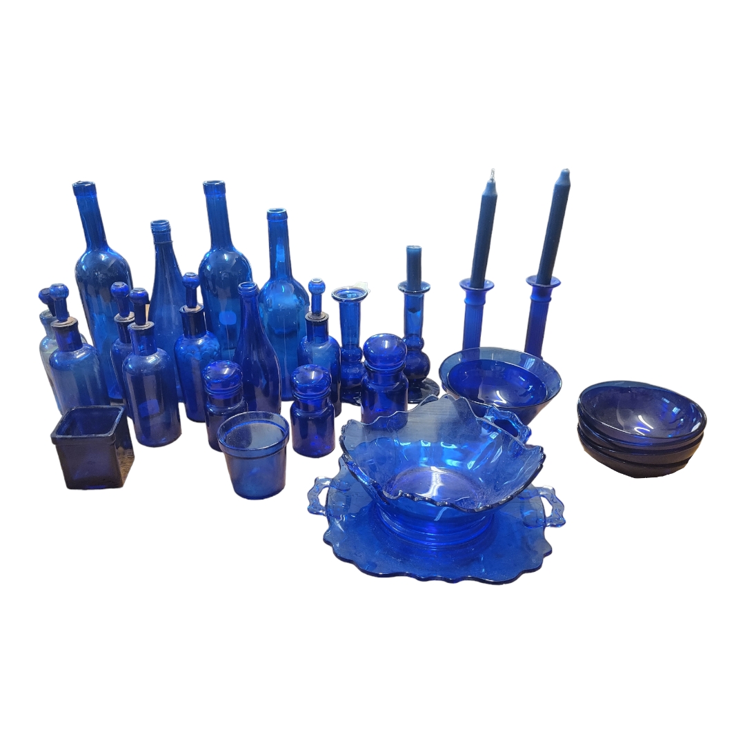 A COLLECTION OF 20TH CENTURY BRISTOL BLUE GLASS CHEMIST BOTTLES, JARS, CANDLESTICKS AND BOWLS