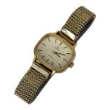 OMEGA, A VINTAGE GOLD PLATED LADIES’ WRISTWATCH Having a rectangular form silver tone dial and