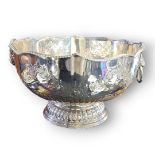 A LARGE SILVER PLATE ON COPPER PUNCH BOWL Having a gadrooned border and embossed floral