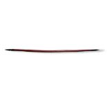 AN ANTIQUE NATIVE AMERICAN INDIAN WOODEN BOW Of curved tapering form with carved finials and hand