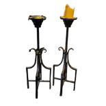 A PAIR OF LARGE 20TH CENTURY FLOOR STANDING WROUGHT IRON CANDLESTICKS Having a heavy pricket