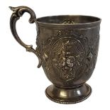 A VICTORIAN SILVER CHRISTENING MUG Having a single handle and embossed floral decoration, hallmarked