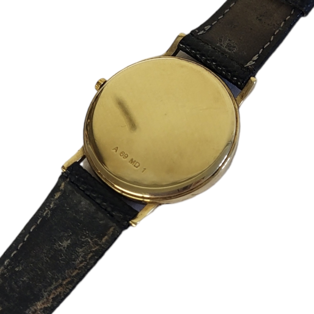 WATCHES OF SWITZERLAND, A VINTAGE YELLOW METAL GENT’S WRISTWATCH Having a circular white dial and - Image 3 of 3