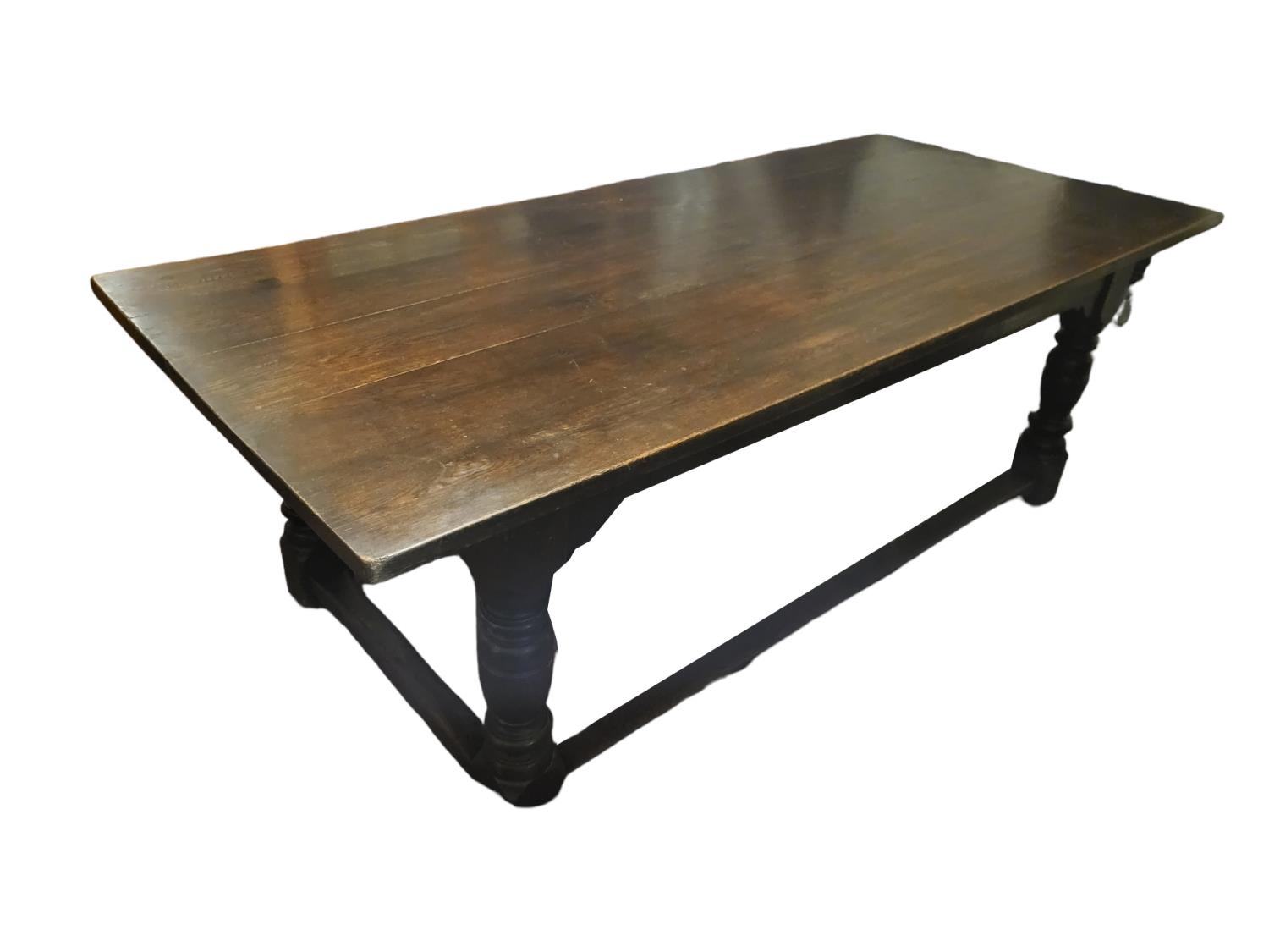 A 17TH CENTURY STYLE SOLID OAK REFECTORY TABLE The five plank top raised on four heavy turned and