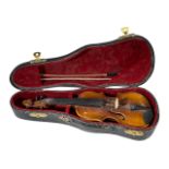 AN EARLY 20TH CENTURY MINIATURE APPRENTICE PIECE VIOLIN AND BOW IN CASE. (violin length 20cm x w 6.