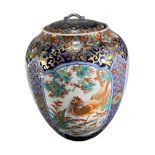 A LATE 19TH/EARLY 20TH CENTURY JAPANESE LIDDED JAR Having cranes, herons and peacocks amongst a