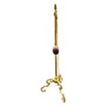 A FRENCH ORMOLU AND GILT METAL FLOORSTANDING LAMP With porcelain acorn decoration, raised on three