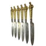 F.B. THOMAS & CO., A COLLECTION OF SIX 19TH CENTURY GILT HANDLE FIGURAL KNIVES. Marked ‘Thomas