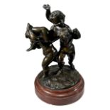 A 19TH CENTURY BRONZE FIGURAL GROUP OF PUTTI AT PLAY, RAISED ON CIRCULAR RED MARBLE BASE. (h 20cm
