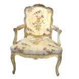 A LATE 19TH/EARLY 20TH CENTURY FRENCH CARVED WOOD AND PAINTED OPEN ARMCHAIR Decorated with scrolling