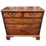 A SMALL GEORGE III MAHOGANY CHEST OF TWO SHORT OVER THREE LONG GRADUATED DRAWERS With swan neck