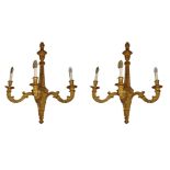 MANNER OF ROBERT ADAM, A LARGE PAIR OF 18TH CENTURY DESIGN CARVED GILTWOOD THREE BRANCH WALL SCONCES