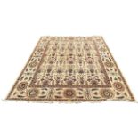 A LARGE AFGHANISTAN AGRA BEIGE GROUND CARPET The central with repeating urns and floral pattern. (