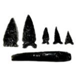 A COLLECTION OF FIVE OBSIDIAN ARROWHEADS AND OBSIDIAN CUTTING TOOL, POSSIBLY NEOLITHIC. (largest