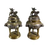 A PAIR OF LATE 19TH/EARLY 20TH CENTURY JAPANESE BRONZE INCENSE BURNERS Having Komainu lion dogs