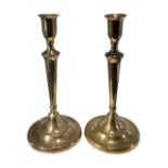 A PAIR OF EARLY 19TH CENTURY GEORGIAN GUNMETAL CANDLESTICKS. (h 28.5cm x d 13.4cm)