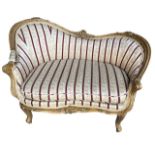 A SMALL 19TH CENTURY FRENCH LOUIS XV DESIGN CARVED GILTWOOD AND GESSO BEDROOM SETTEE The frame