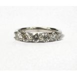 AN 18CT WHITE GOLD FIVE STONE DIAMOND RING. (Approx diamonds 1.09ct)