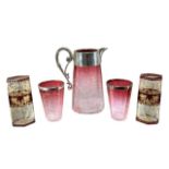 A VICTORIAN CRANBERRY GLASS AND SILVER PLATED WATER JUG AND TWO CUPS Together with two Bohemian