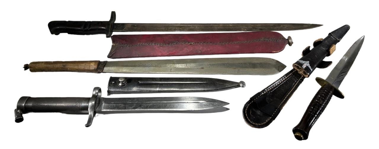 A COLLECTION OF FOUR WWI AND WWII BAYONETS AND DAGGERS To include an early 20th Century Swedish EJ