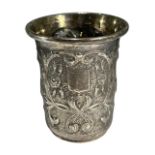 A 19TH CENTURY RUSSIAN SILVER CUP Having chased and repousse floral decoration, two empty