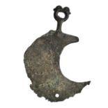 A BRONZE AGE CRESCENTIC RAZOR. (length 10cm x w 6.9cm)