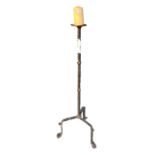 A 17TH CENTURY DESIGN WROUGHT IRON FLOORSTANDING TRIPOD CANDLE PRICKET STAND. (h 127cm)