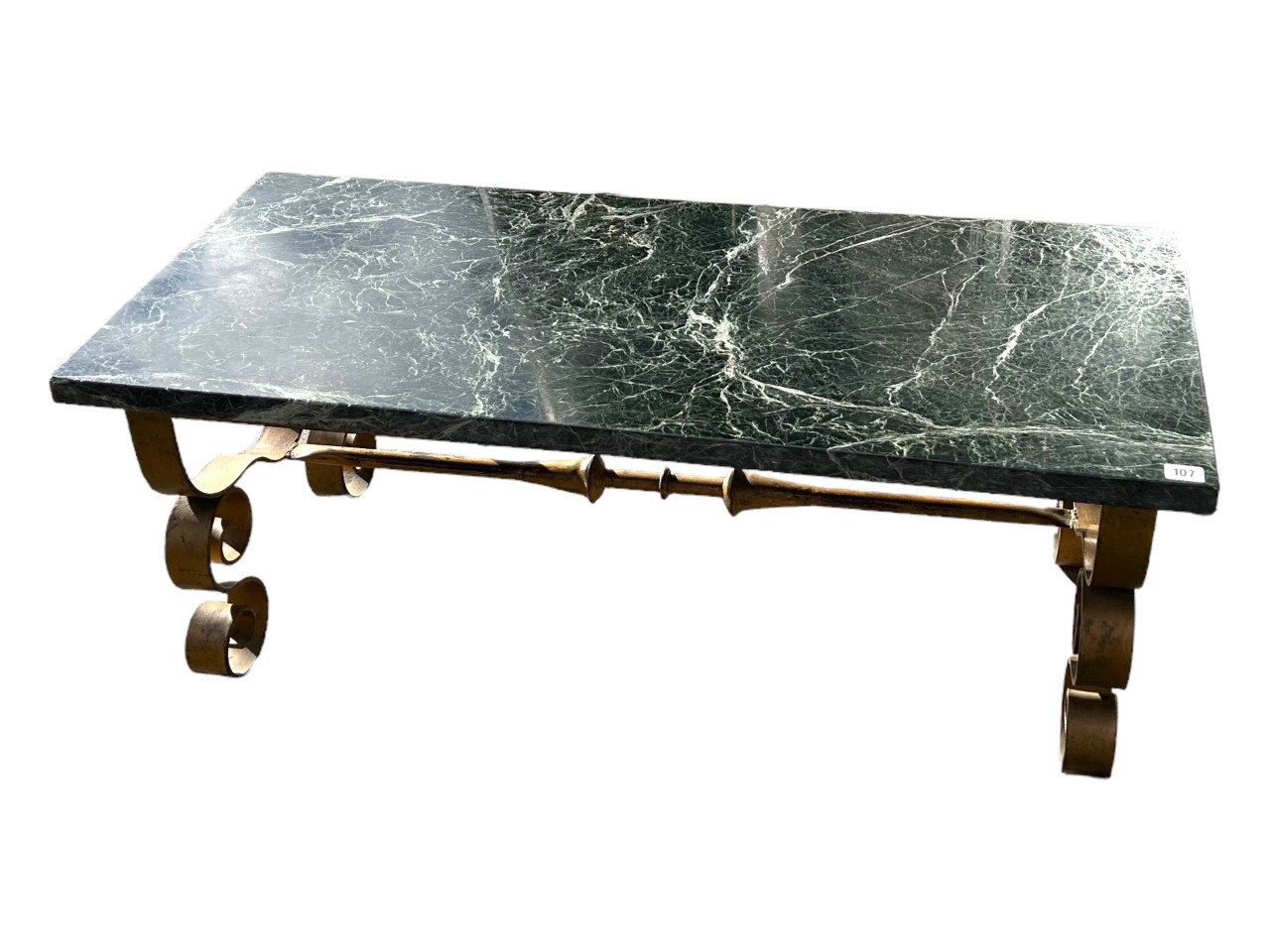 MANNER OF GILBERT POILLERAT, A 20TH CENTURY FRENCH MARBLE TOP COFFEE TABLE Raised on scrolling