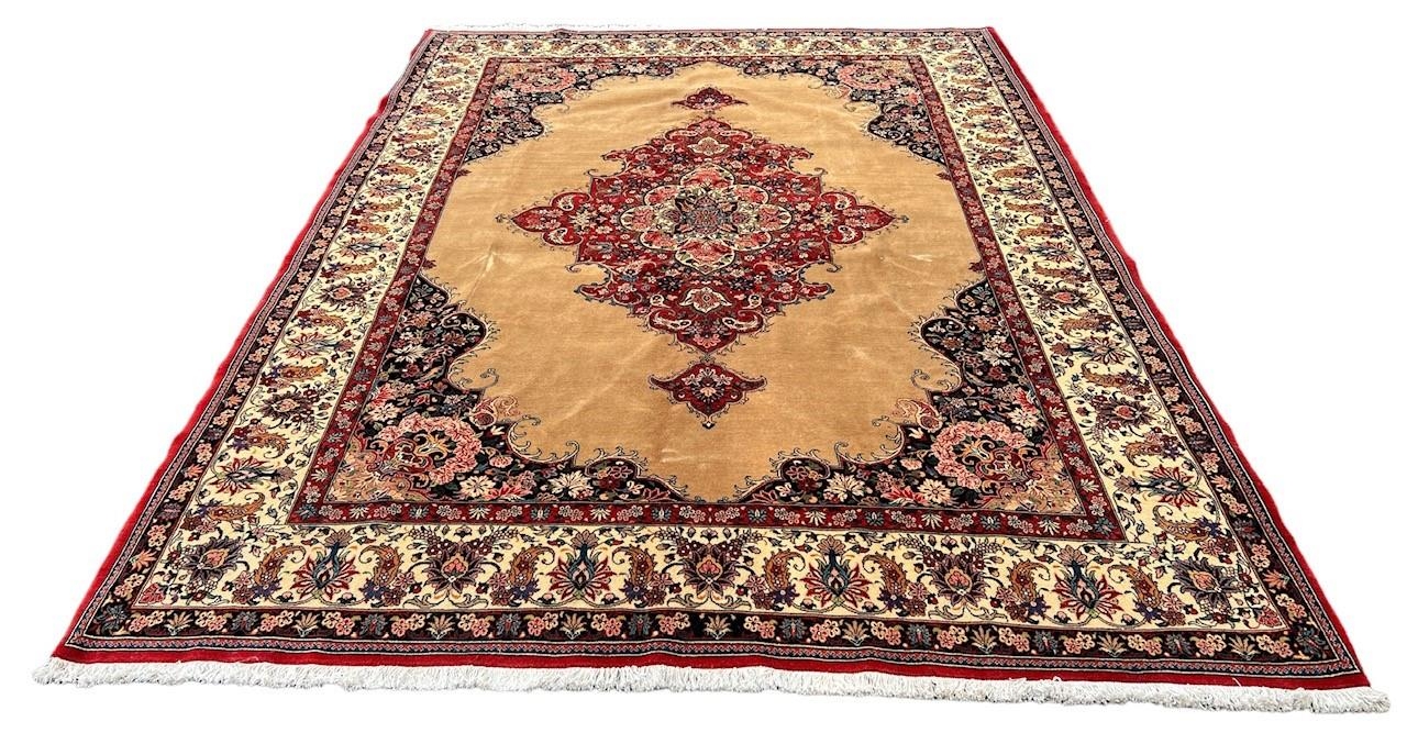 A LARGE PERSIAN BEIGE GROUND CARPET With central floral diamond. (366cm x 256cm)