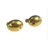 A PAIR OF 18CT GOLD OVAL CLIP ON EARRINGS Having deep heart decorations. (h 18mm x w 12mm x depth