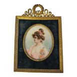 RUCHAT, A 19TH CENTURY OVAL MINIATURE PORTRAIT ON IVORY Young lady with pink ribbon and dress,