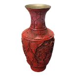 AN EARLY 20TH CENTURY CHINESE RED CINNABAR LACQUERED ‘FLORA’ VASE, CIRCA 1900 - 1910 A baluster form