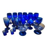 A LARGE COLLECTION OF 20TH CENTURY BRISTOL BLUE GLASS PLATES, DRINKING GLASSES, CHEMIST BOTTLES,