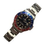 ROLEX, GMT-MASTER, A VINTAGE STAINLESS STEEL GENT’S WRISTWATCH Having a blue and red enamel '